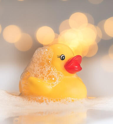 A rubber ducky in a bubble bath